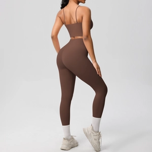 Back view of chocolate brown yoga set with cross straps and high waisted leggings