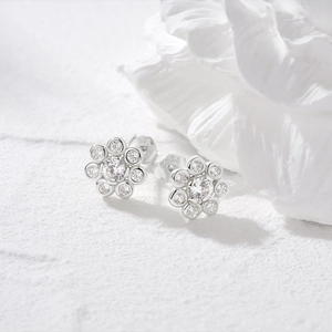 Close-up of S925 sterling silver flower earrings with sparkling cubic zirconia stones