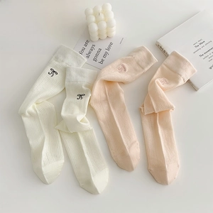 Chaussettes résille style ballet avec nœud en blanc laiteux et rose clair doux