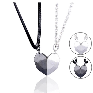 Magnetic heart pendant necklaces for couples featuring grey and silver interlocking stones