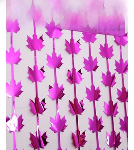 Detail of rose purple maple leaf foil curtain with metallic mirror finish for parties