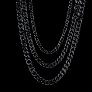Detailed view of three black stainless steel Cuban link chains in different lengths