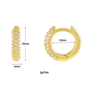Detailed view of gold huggie earrings showing 18mm height and 4mm width dimensions