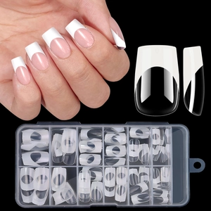 Detail of pink and white French square press-on nails in a multi-size storage box