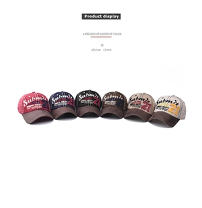 Detail of vintage washed baseball caps with high-quality 3D embroidered Submit 21 logo