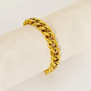 Polished 18K gold chunky Cuban link chain bracelet for women in minimalist street style