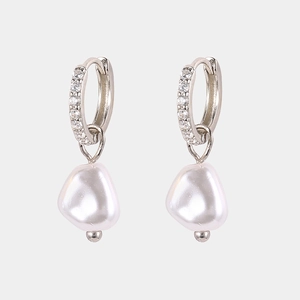 Close-up of S925 silver hoop earrings with white baroque pearls and small diamonds