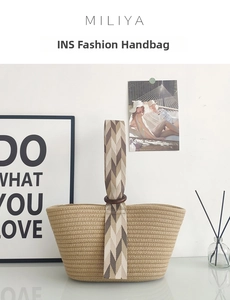 Detailed view of woven cotton rope bag featuring geometric patterned strap and wooden rings