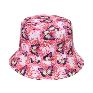 Summer bucket hat with vibrant pink flora and purple butterfly prints on canvas
