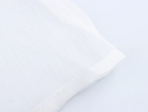 Close-up of white vertical stripe fabric texture and refined stitching of the dress