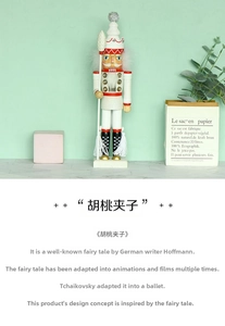 Macro detail of wooden nutcracker soldier with white crown and golden spear decor