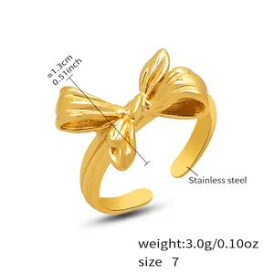 Detail view of bow ring specifications showing 1.3cm width and stainless steel texture