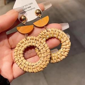 Handmade woven rattan hoop earrings with orange wood accents and 925 silver needles