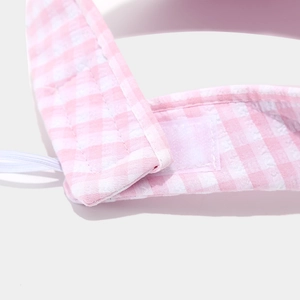 Detail of pink gingham sun hat with adjustable velcro strap and elastic drawstring