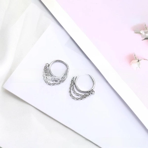 Detail view of silver 316L stainless steel hoop earrings with multi-layer hanging chains