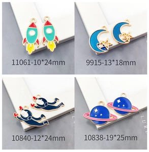Detail of rocket and astronaut charms with dimensions for DIY jewelry making