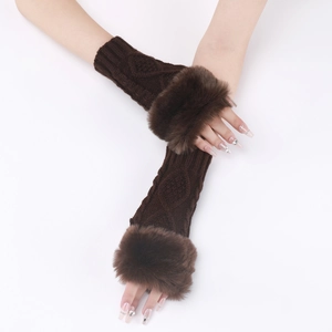 Detail of coffee brown cable knit fingerless gloves with plush faux fur trim on arm
