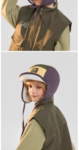 Detail of kids winter trapper hat and vest with thick fleece lining for warmth
