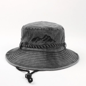 Detail of dark grey washed cotton sun hat with mountain embroidery and windproof cord