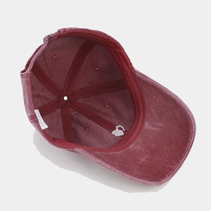 Washed vintage burgundy baseball cap with small heart embroidery and internal sweatband