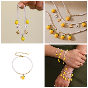 Detail of pearl bracelet with lemon, bee, and daisy charms in a four-grid display