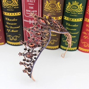 Detail of vintage Baroque bridal crown with rose gold metal and multi-color rhinestones