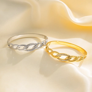 Twisted cable cuff bracelets with cubic zirconia in 18K gold and silver plating