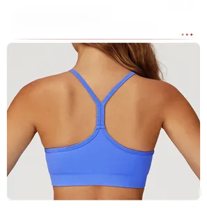 Close-up of bright blue seamless sports bra featuring Y-back straps and wide ribbed hem