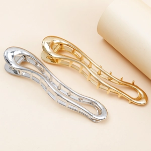 Minimalist wavy metal hair claw clips in polished gold and silver finish set