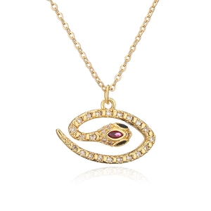 Bohemian gold plated snake pendant necklace with sparkling zircons and red gem eyes