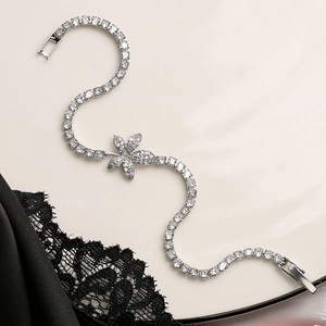 Elegant silver leaf bracelet with sparkling white zircon stones in an S-curve design