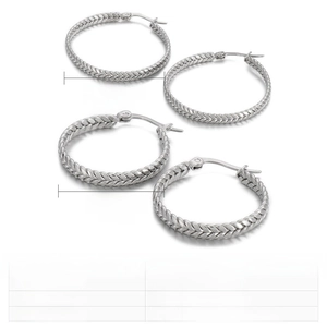 Detail view of twisted stainless steel hoop earrings in 35mm and 25mm diameter sizes