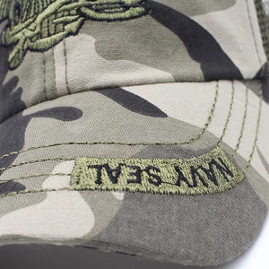 Macro detail of Navy Seal embroidery and durable camo mesh on a tactical baseball cap
