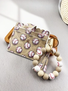 Detail shot of a baseball pattern PU leather card holder with beaded bracelet and tassel