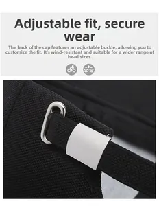 Close-up of adjustable silver metal buckle and breathable black mesh fabric on a baseball cap