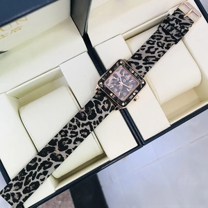 Detail view of square quartz watch with leopard print strap and rose gold bezel