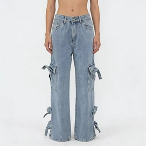 Detail of light blue cargo jeans showing large utility pockets and ribbon tie accents