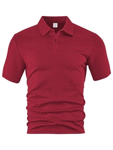 Detailed view of red polo shirt with breathable jacquard diamond texture and collar