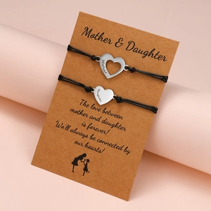 Mother Daughter matching heart bracelets with adjustable black cords and silver pendants