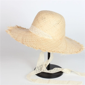 Handmade raffia wide-brim sun hat for women with elegant white lace ribbon and fringe