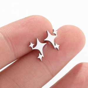 Handheld silver stainless steel star stud earrings with a minimalist geometric star design