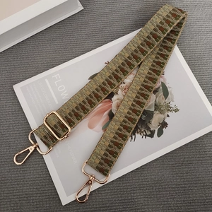 Adjustable woven shoulder strap for handbags with green and brown geometric pattern