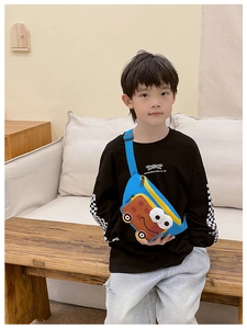 Detail of blue cartoon car crossbody bag with waffle texture pocket and large eyes decoration