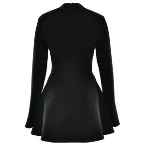 Detail showing back cutout with buttons and invisible zipper on black A-line dress