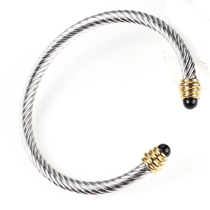 Silver twisted cable open cuff bracelet with gold accents and black end caps