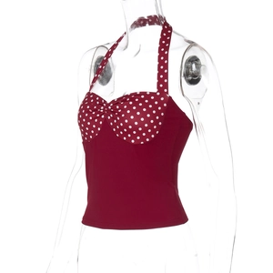 Close-up of red polka dot halter top with sweetheart neckline and twisted knot detail