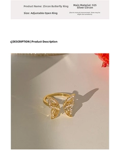 Detail of adjustable 925 silver butterfly ring with sparkling gold-tone zircon pavé