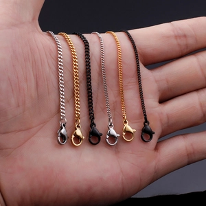 Detail of 18K gold-plated titanium steel chains with lobster clasps in gold, silver, and black