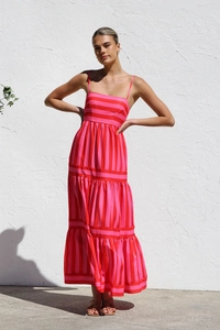 Detail of multi-layered tiered A-line maxi dress with pink and red stripes for summer