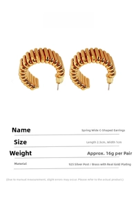 Detailed view of golden spring texture wide C-shape earrings made of gold-plated brass